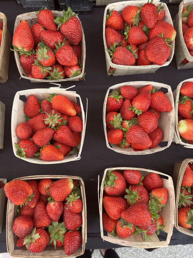 Fresh strawberries stacked in quart boxes