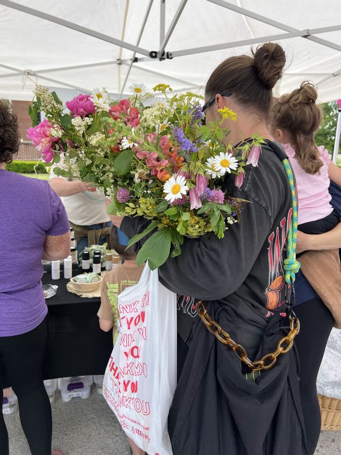 A fresh-cut flower bouquet held at the market