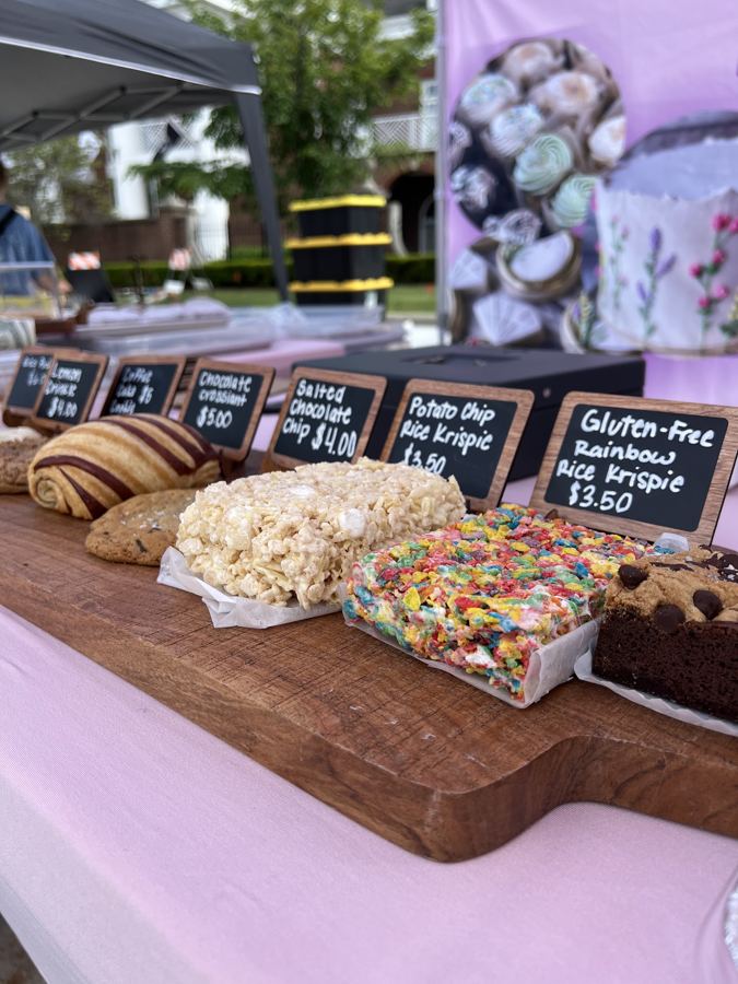 Baked goods and labeled treats on a vendor table